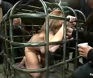 Locked in cage blonde groped and toyed by strangers